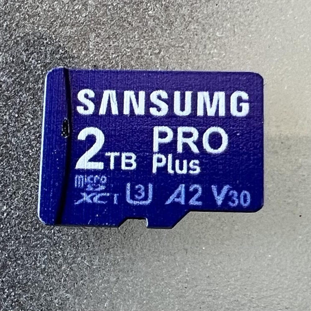 A counterfeit memory card labelled SANSUMG 2TB PRO Plus, a fake that reports far more storage than it actually holds