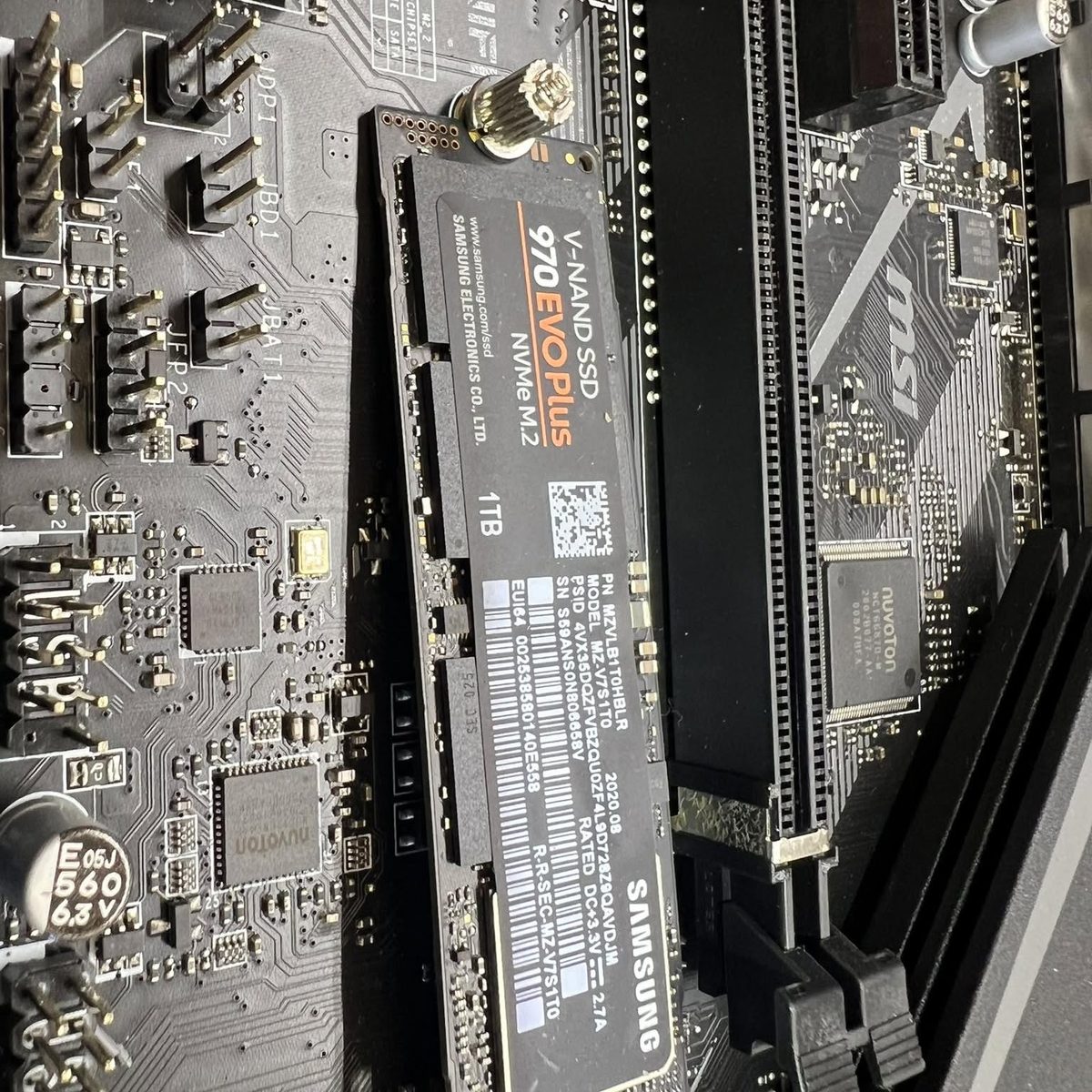 A Samsung NVMe solid state drive being installed on a motherboard during a computer upgrade at iCompute in Coos Bay